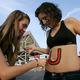 Illustration for article titled Rutgers Girls Undergo Ritual Football-Season Bodypainting